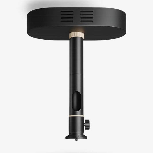 Photograph of a sleek matte black ceiling mount featuring an oval plate with horizontal grooved slits, a central cylindrical pole with two cream rings, an elongated vertical cutout, and a side adjustment knob